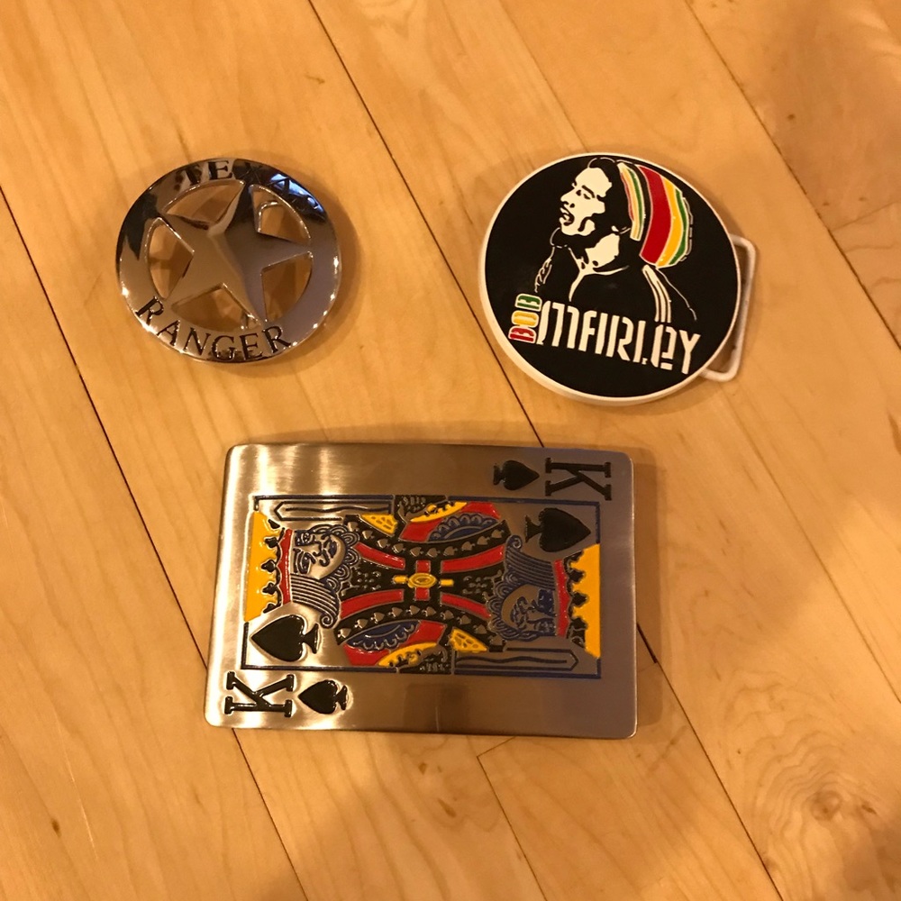 Assorted men’s belt buckles. Bob Marley